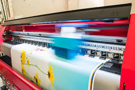 Wide-format printer printing floral design.