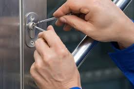 Locksmith picking a commercial door lock.